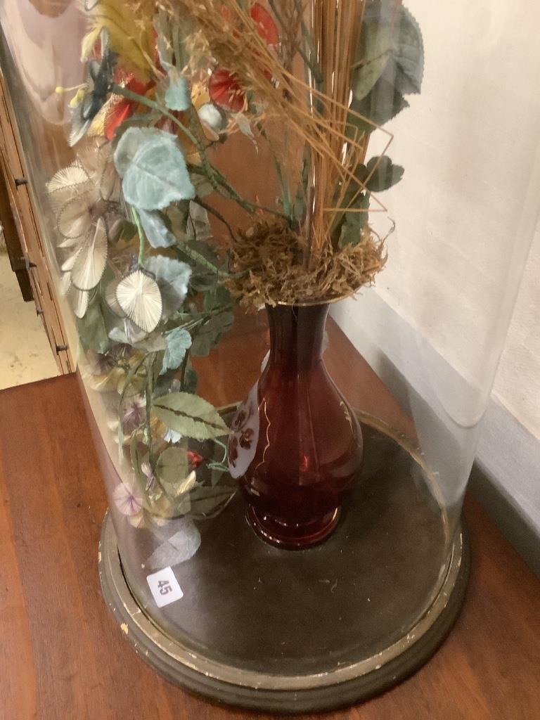 A Victorian fabric floral display under glass dome, height 78cm